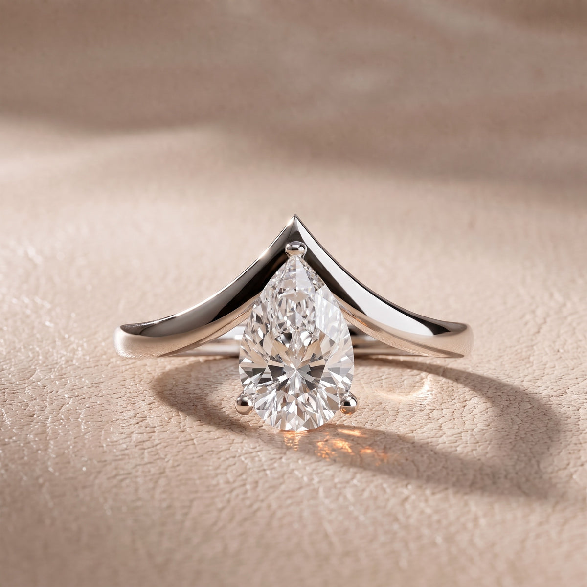 Evelyn Chevron Solitaire Pear Diamond Engagement Ring in Silver - front.jpg