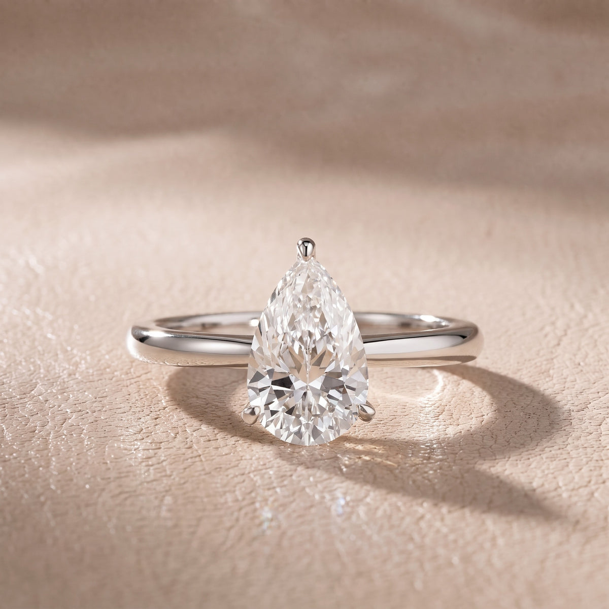 Kalia Knife Edge Solitaire Pear Diamond Engagement Ring in Platinum - front.jpg