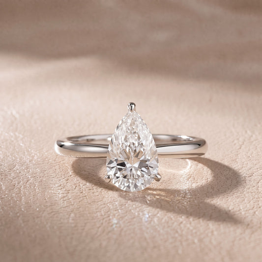 Kalia Knife Edge Solitaire Pear Diamond Engagement Ring in Platinum - front.jpg