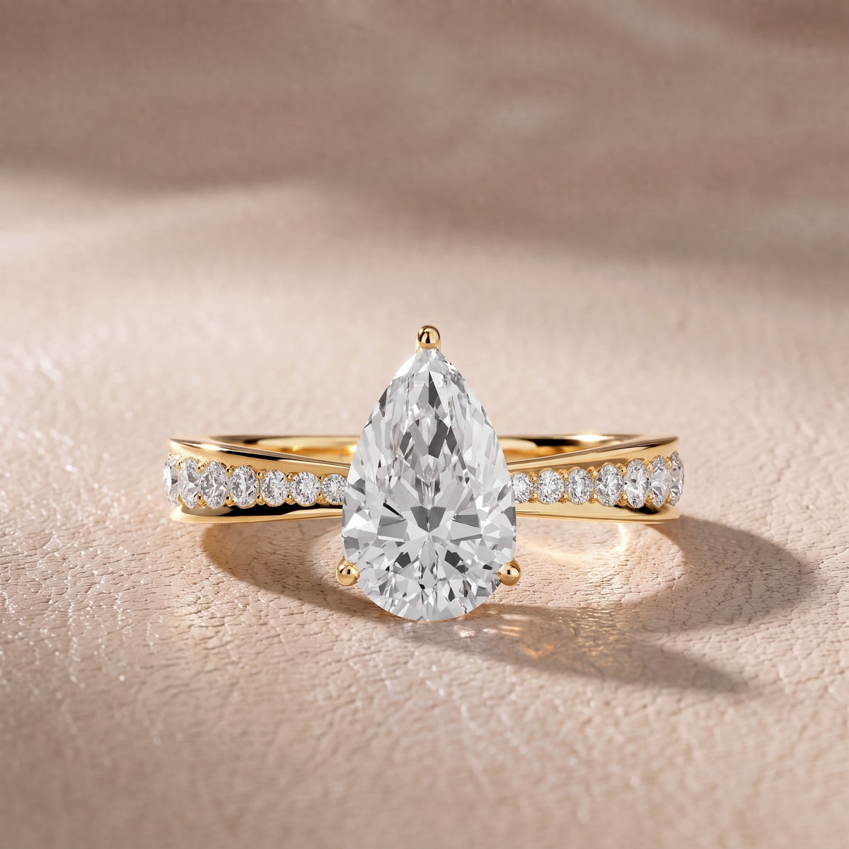 Rhea Sidestone Pavé Pear Diamond Engagement Ring in Yellow Gold - front.jpg