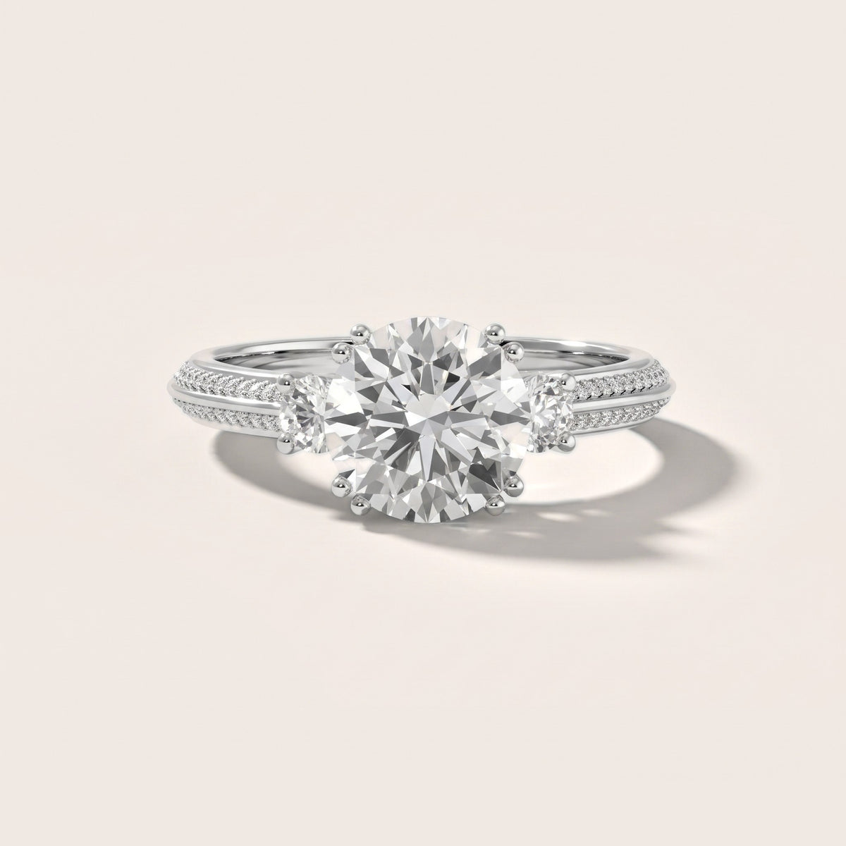 Aspen Three-Stone Knife Edge Round Diamond Engagement Ring in Platinum - front.jpg