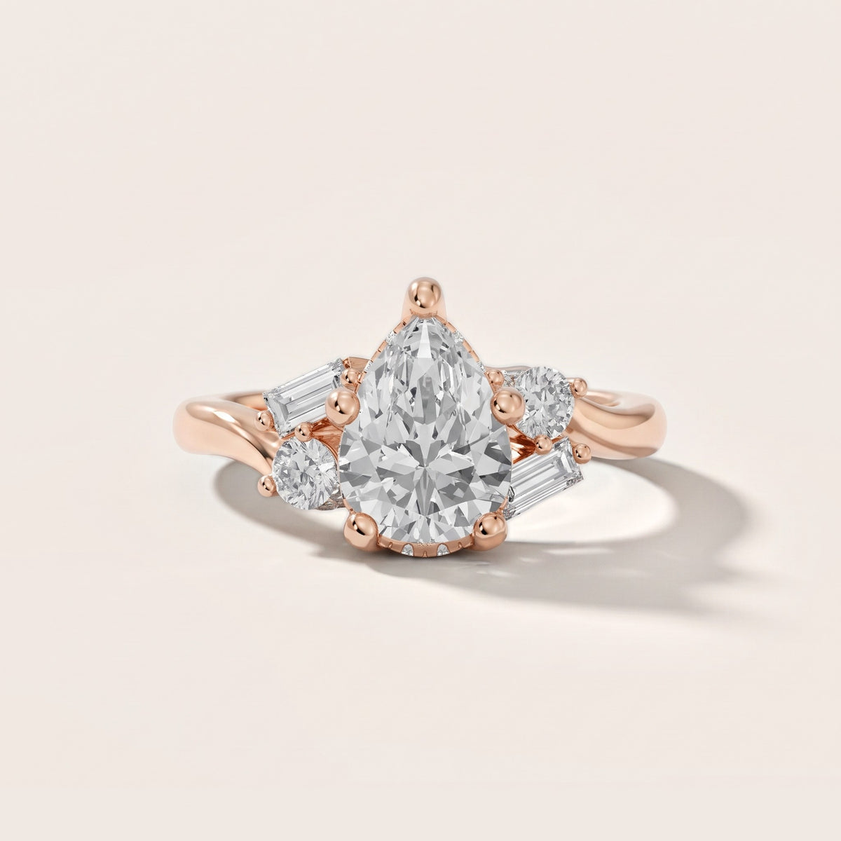 Betty Hidden Halo Cluster Pear Diamond Engagement Ring in Rose Gold - front.jpg