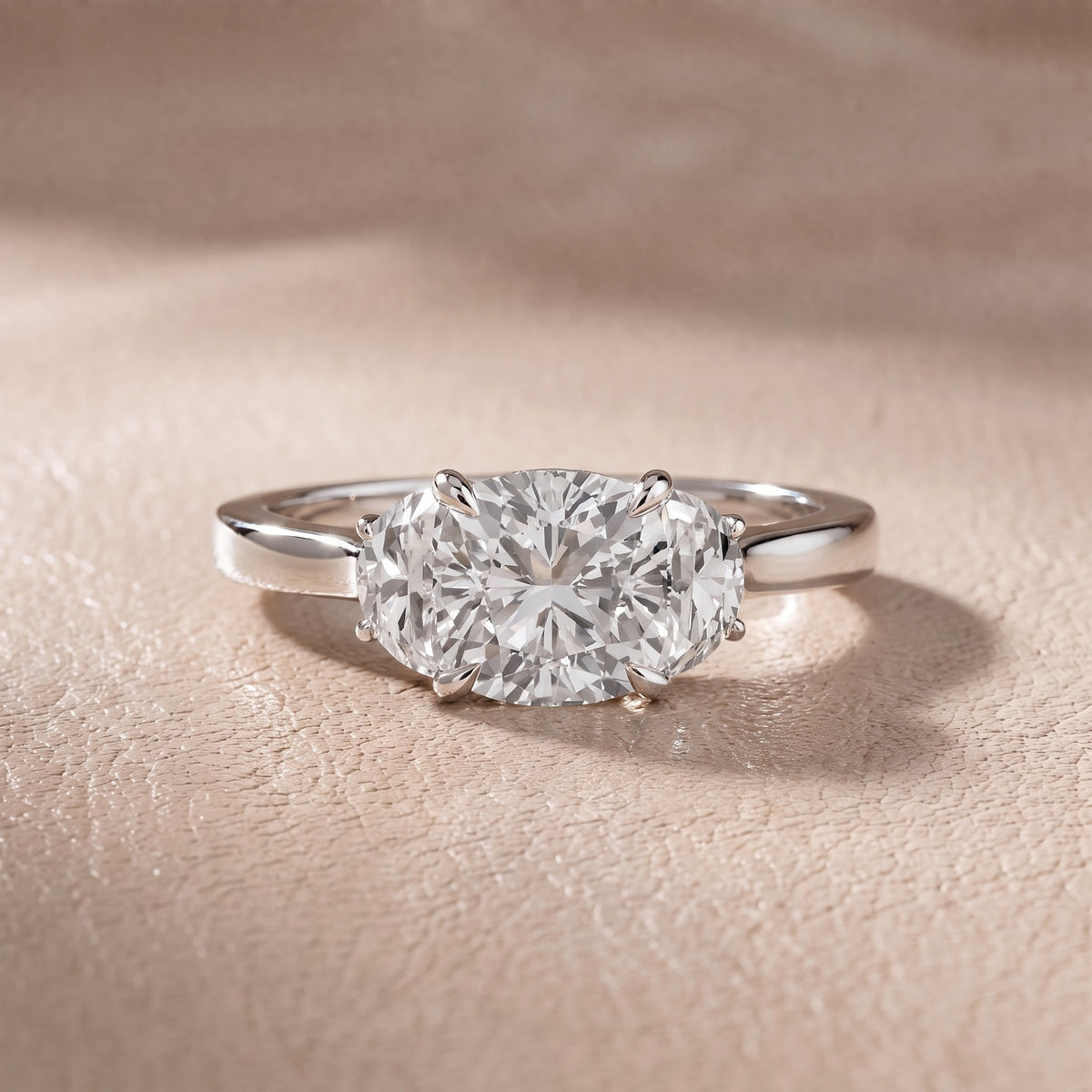 Romy Three-Stone Cushion Diamond Engagement Ring in Platinum - front.jpg