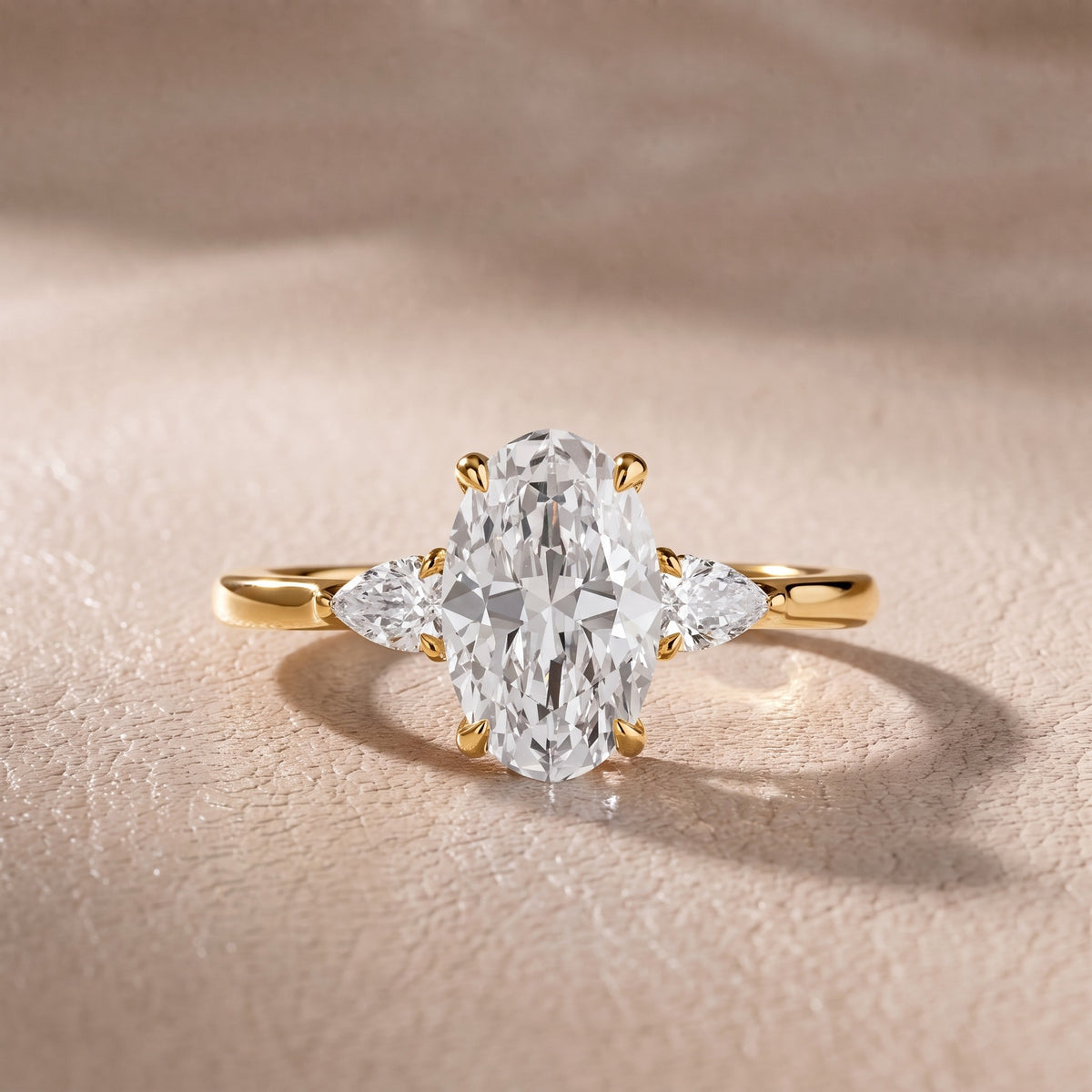 Leila Three-Stone Oval Diamond Engagement Ring in Yellow Gold - front.jpg