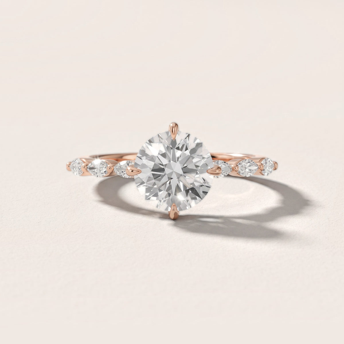April Marquise-Side Round Diamond Engagement Ring in Rose Gold - front.jpg