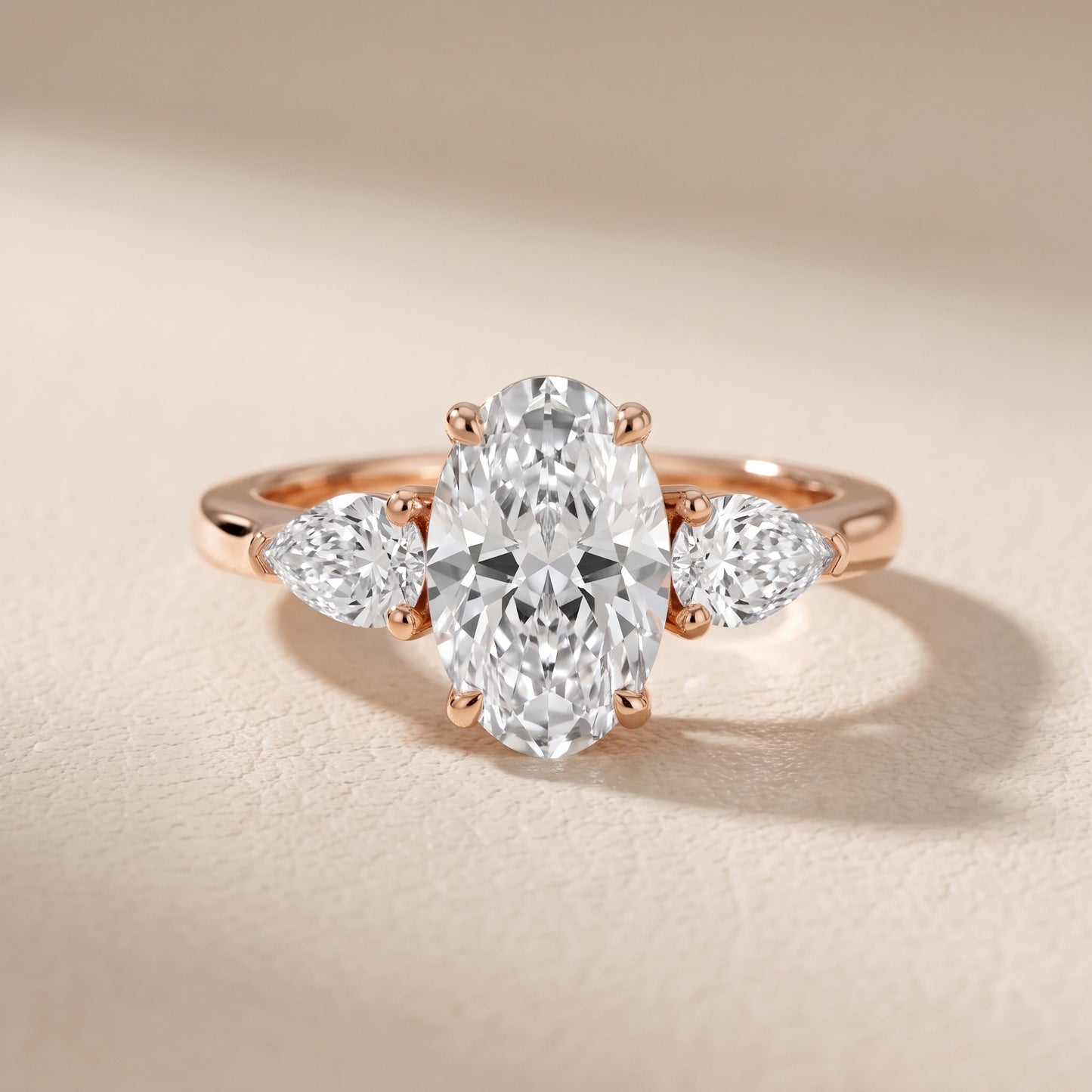 Mirabel Three-Stone Oval Diamond Engagement Ring in Rose Gold - front.jpg