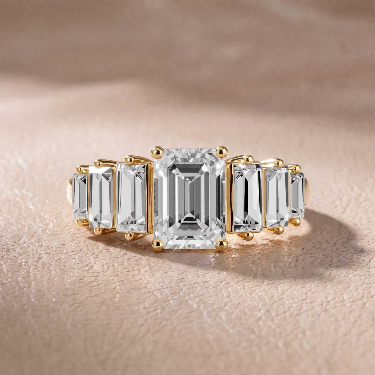 Mara Sidestone Baguette Accent Emerald Diamond Engagement Ring in Yellow Gold - front.jpg