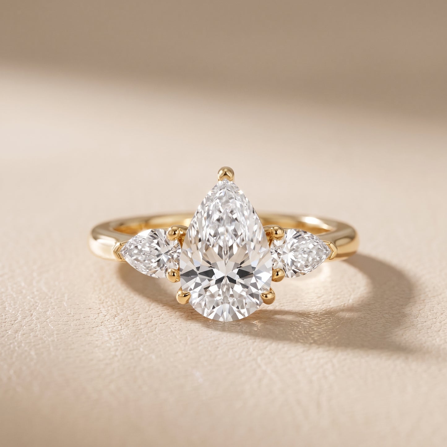 Mirabel Three-Stone Pear Diamond Engagement Ring in Yellow Gold - front.jpg
