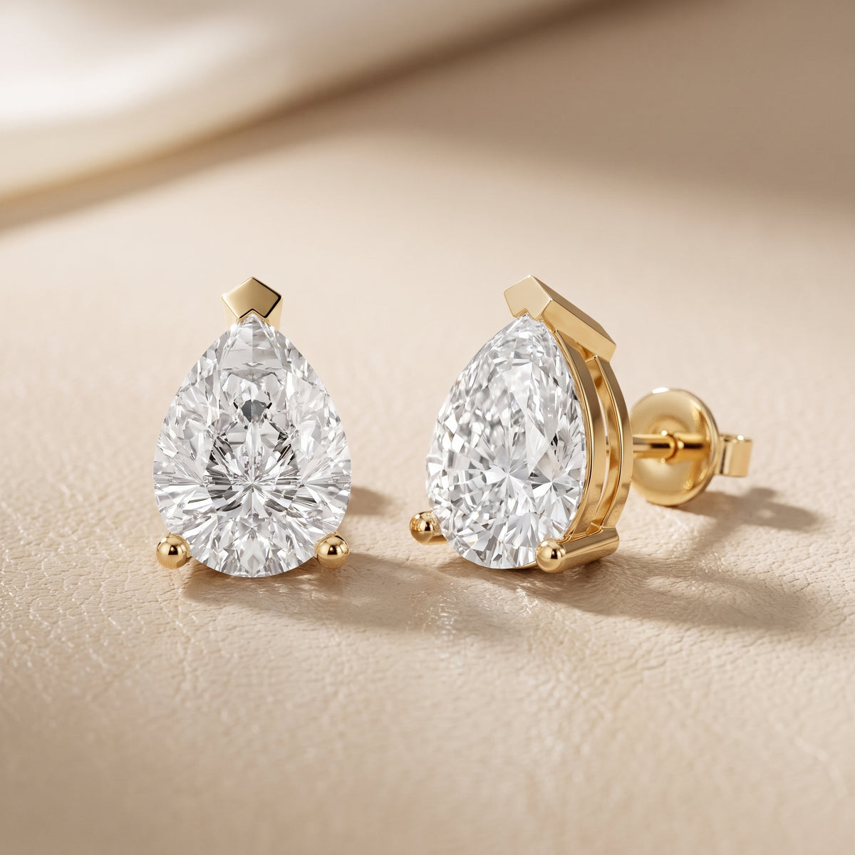 Four Prong Pear Diamond Stud Earrings in Yellow Gold - lifestyle