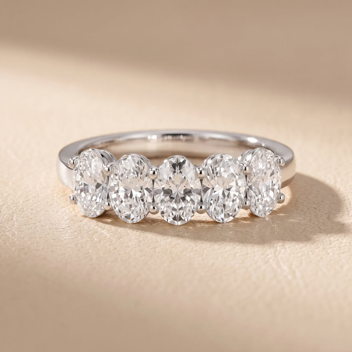 Estela Shared Prong Oval Diamond Wedding Band in White Gold - front.jpg