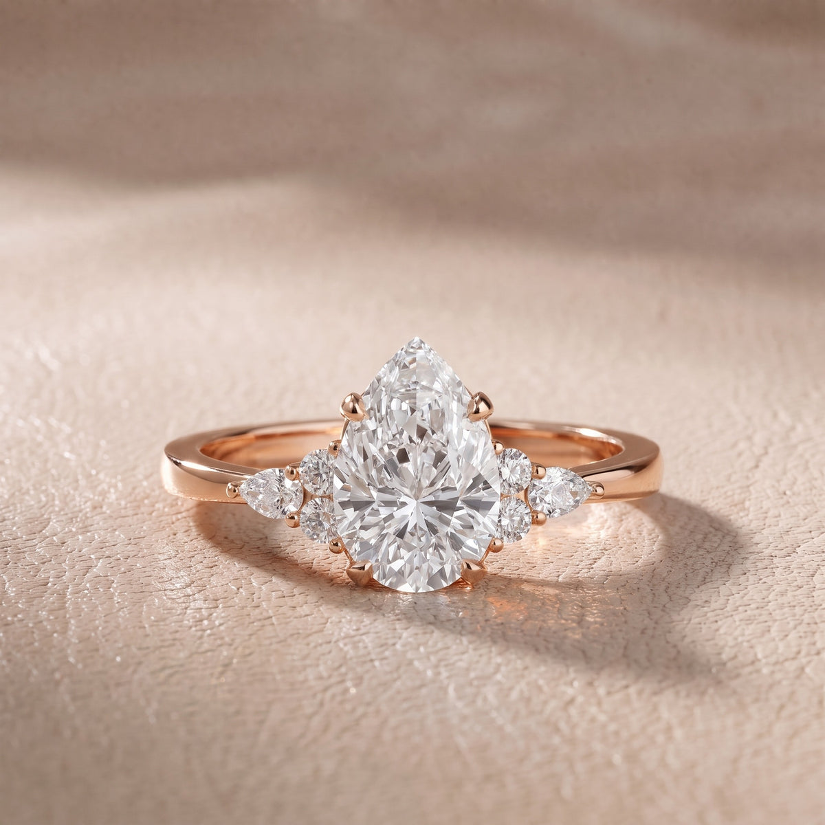 Amelia Three Stone Pear Diamond Engagement Ring in Rose Gold - front.jpg
