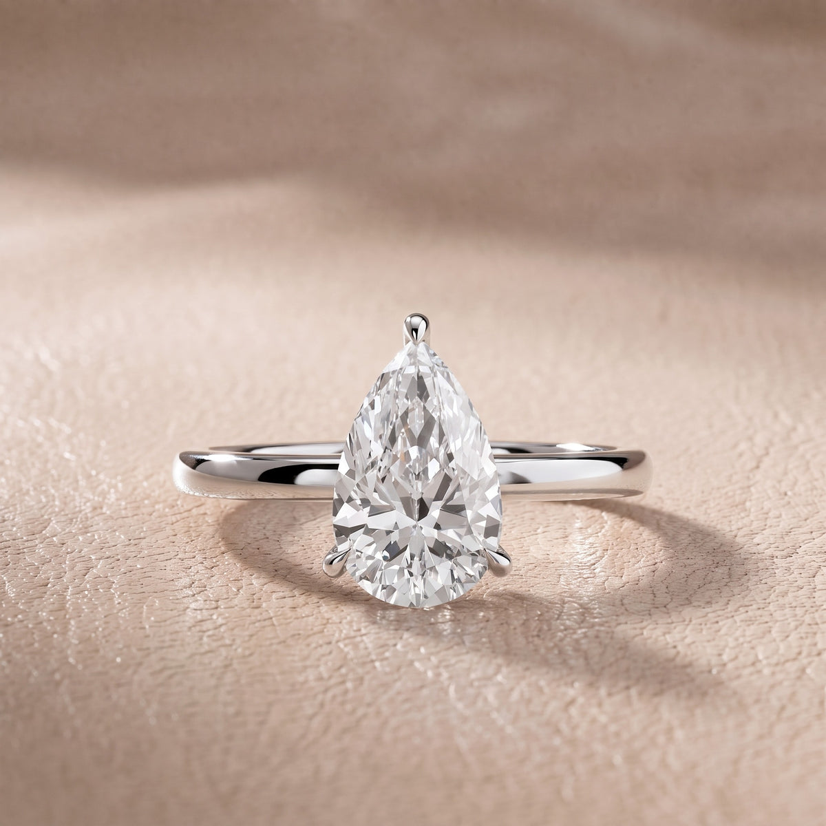 Nadia Petite Solitaire Pear Diamond Engagement Ring in Platinum - front.jpg