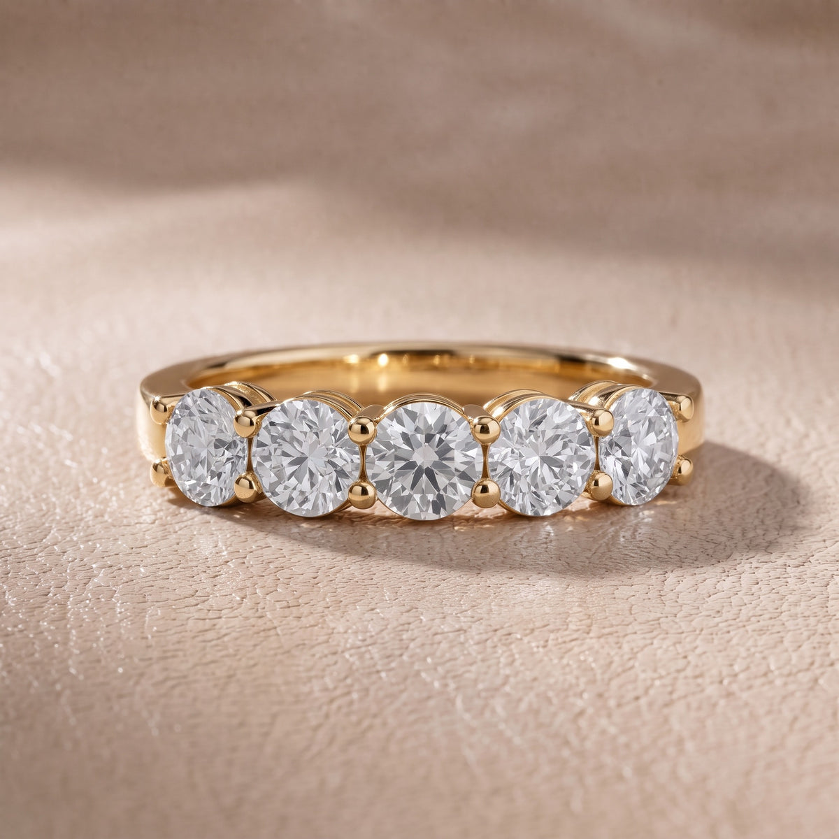 Cecilia Shared Prong Round Diamond Wedding Band in Yellow Gold - front.jpg