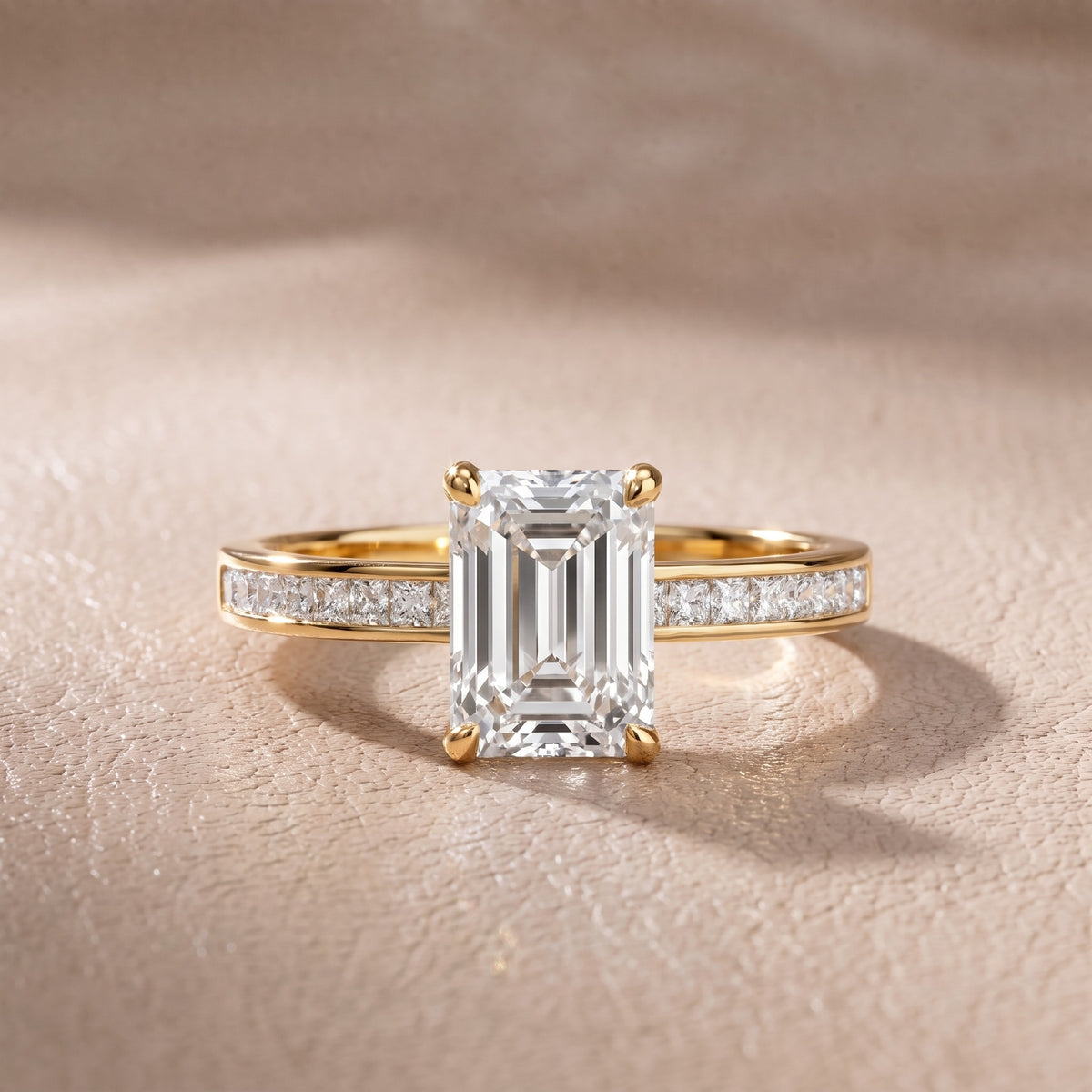 Maren Sidestone Channel Set Emerald Diamond Engagement Ring in Yellow Gold - front.jpg