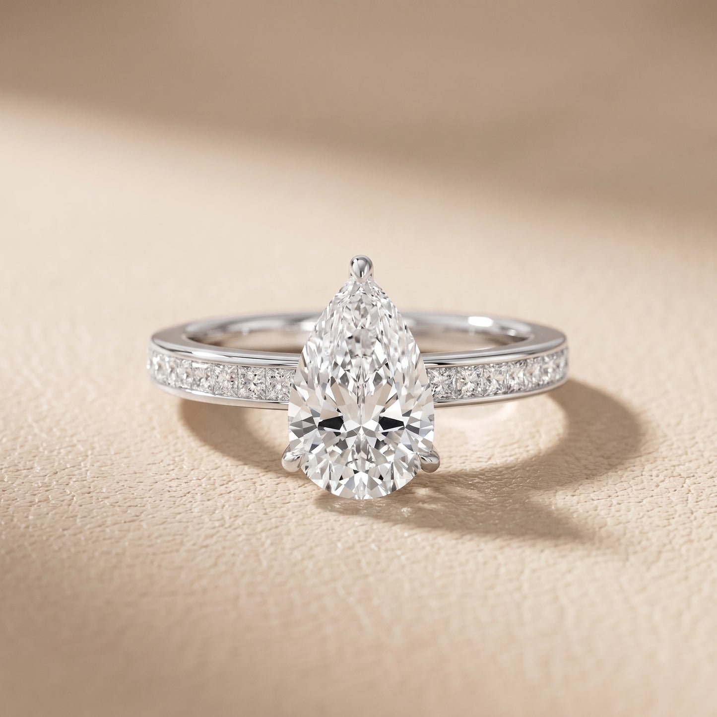Brielle Channel Set Solitaire Pear Diamond Ring in Platinum - front.jpg