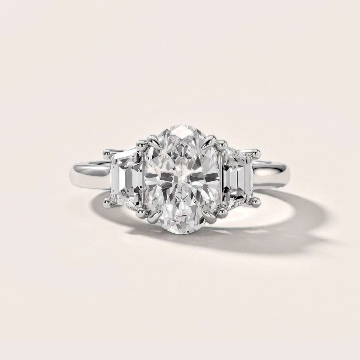 Filippa Trapezoid Three-Stone Oval Diamond Engagement Ring in Platinum - front.jpg