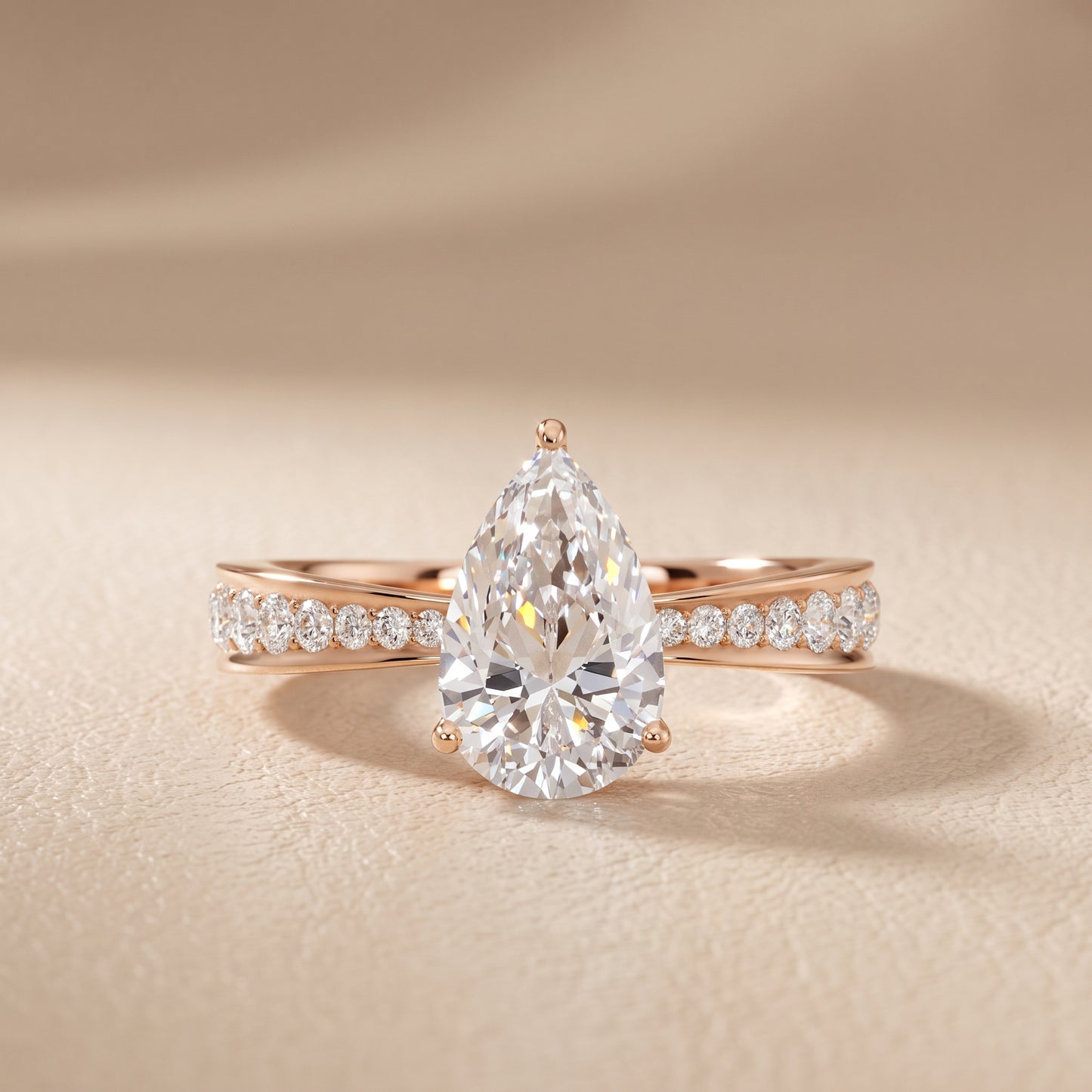 Rhea Sidestone Pavé Pear Diamond Engagement Ring in Rose Gold - front.jpg
