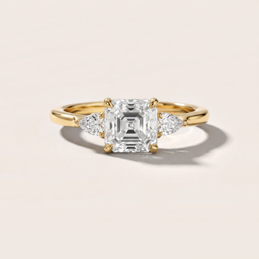 Leila Three-Stone Asscher Diamond Engagement Ring in Yellow Gold