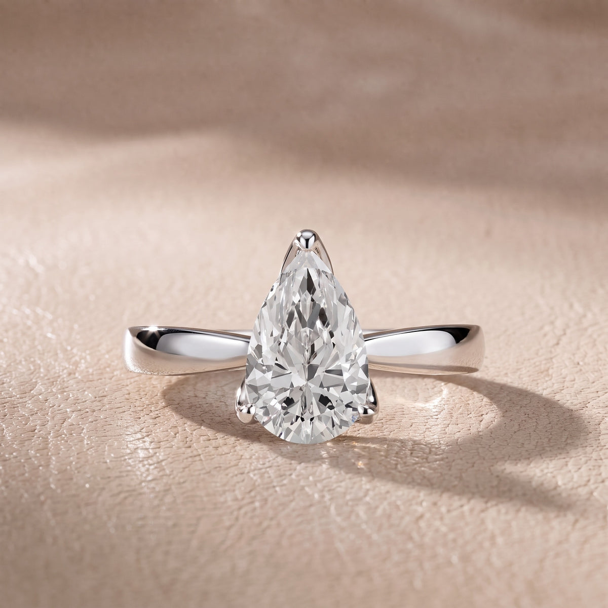 Lucia Solitaire Six-Prong Pear Diamond Engagement Ring in Silver - front.jpg
