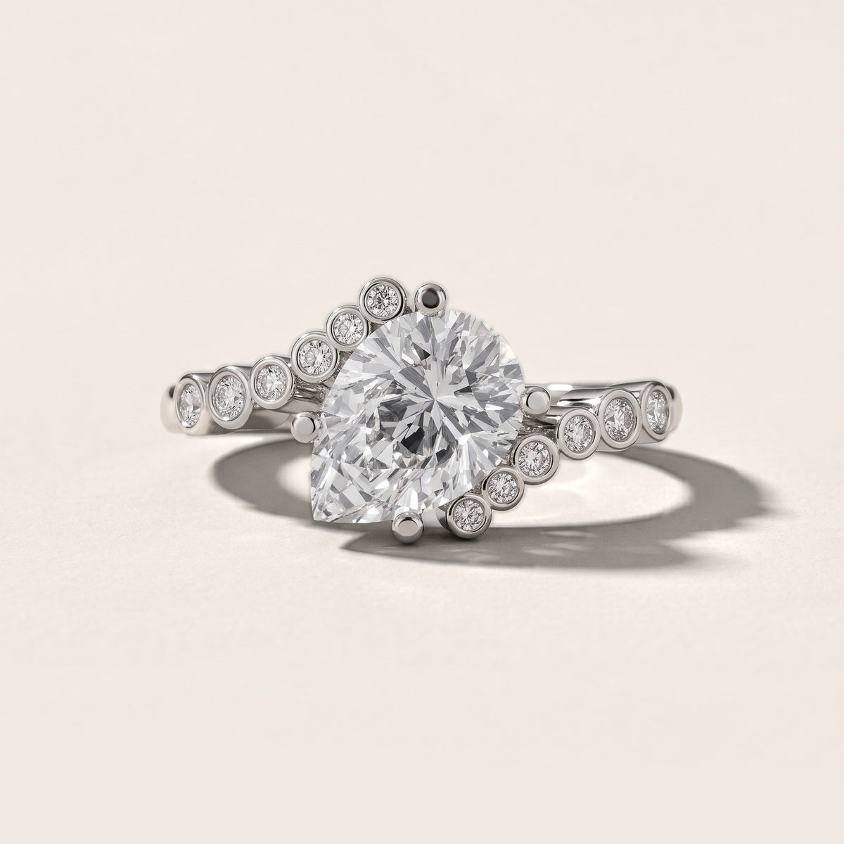 Chatham Bezel Bypass Pear Diamond Engagement Ring in Platinum - front.jpg