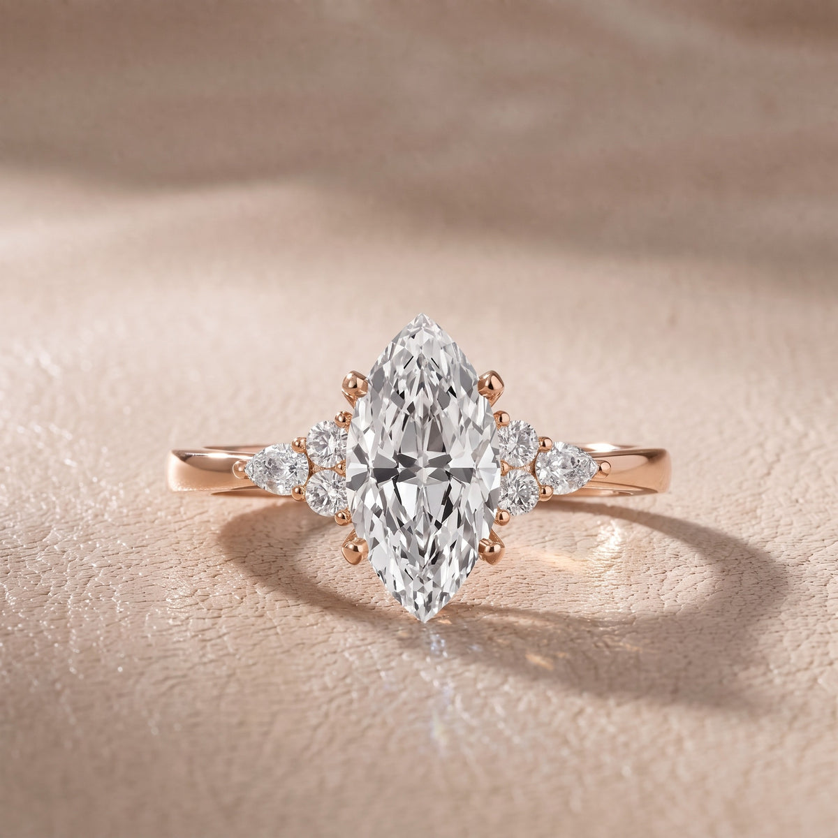 Amelia Three Stone Marquise Diamond Engagement Ring in Rose Gold - front.jpg