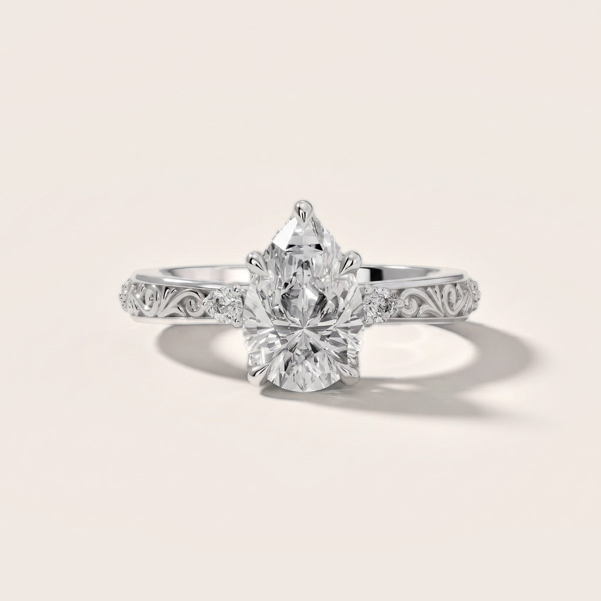 Siesta Three-Stone Engraved Pear Diamond Engagement Ring in Platinum - front.jpg