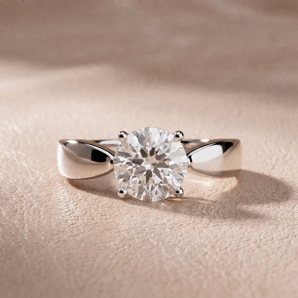 Talia Solitaire Twist Round Diamond Engagement Ring in Platinum - front.jpg