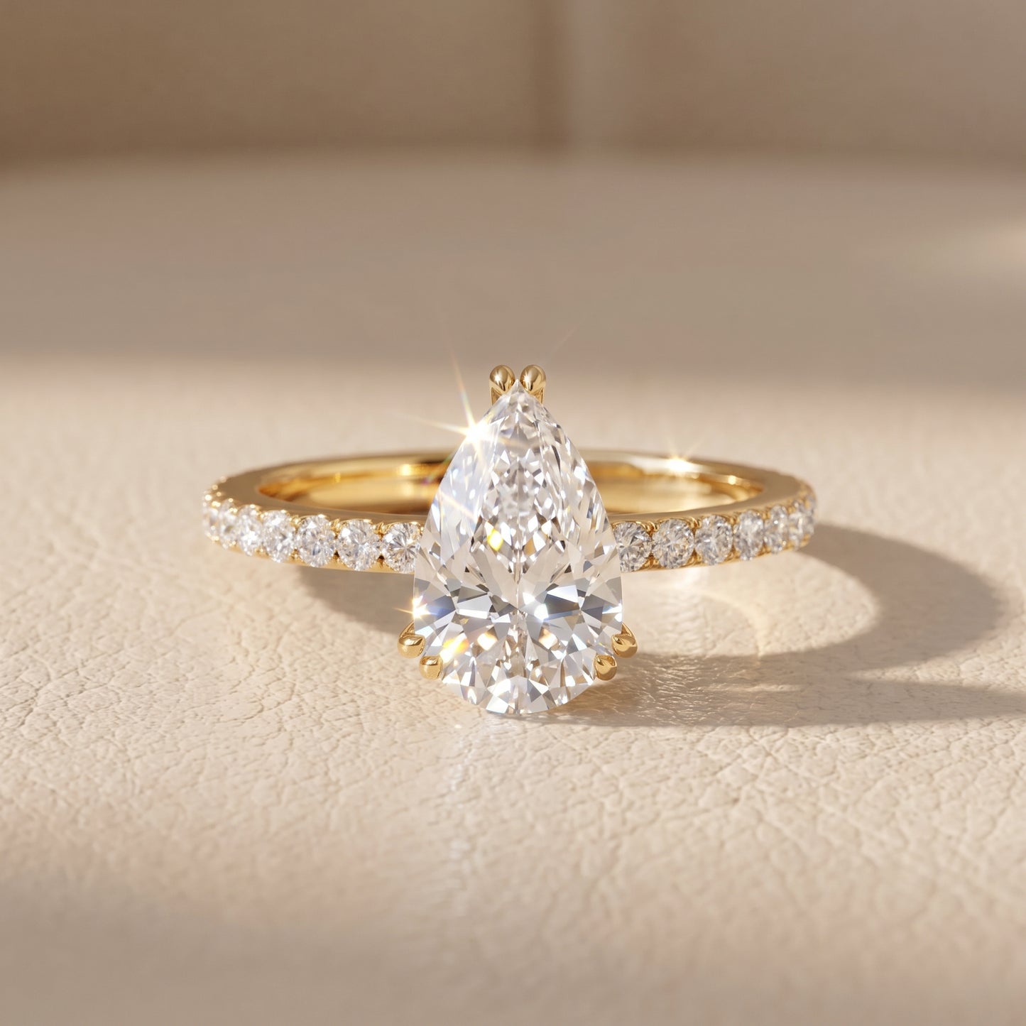 Novara Solitaire Pavé Pear Diamond Ring in Yellow Gold - front.jpg