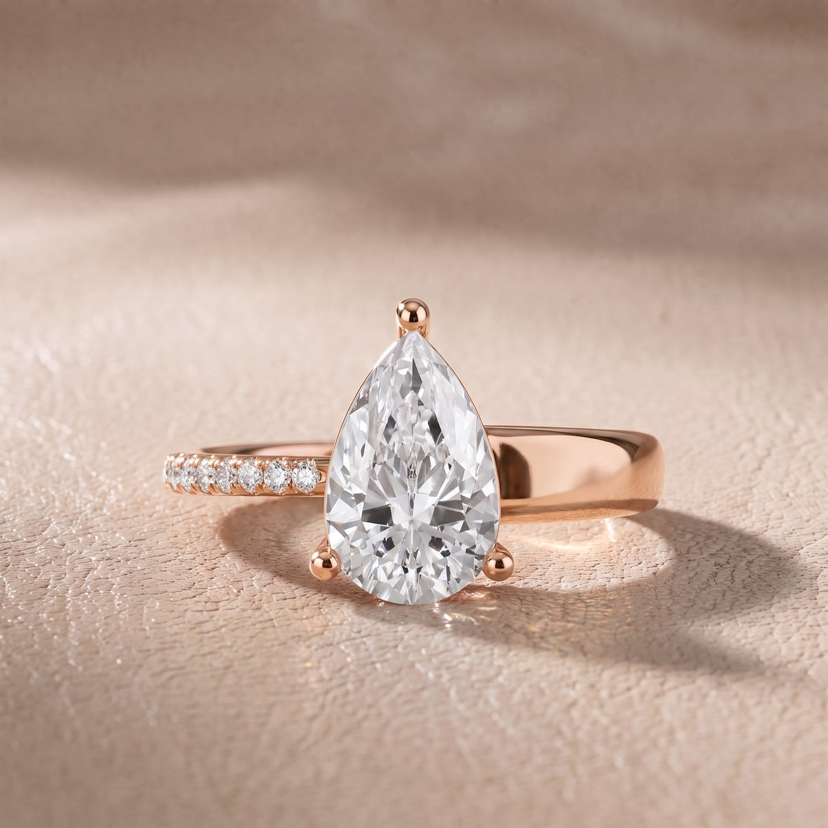 Rosie Solitaire Basket Pear Diamond Engagement Ring in Rose Gold - front.jpg