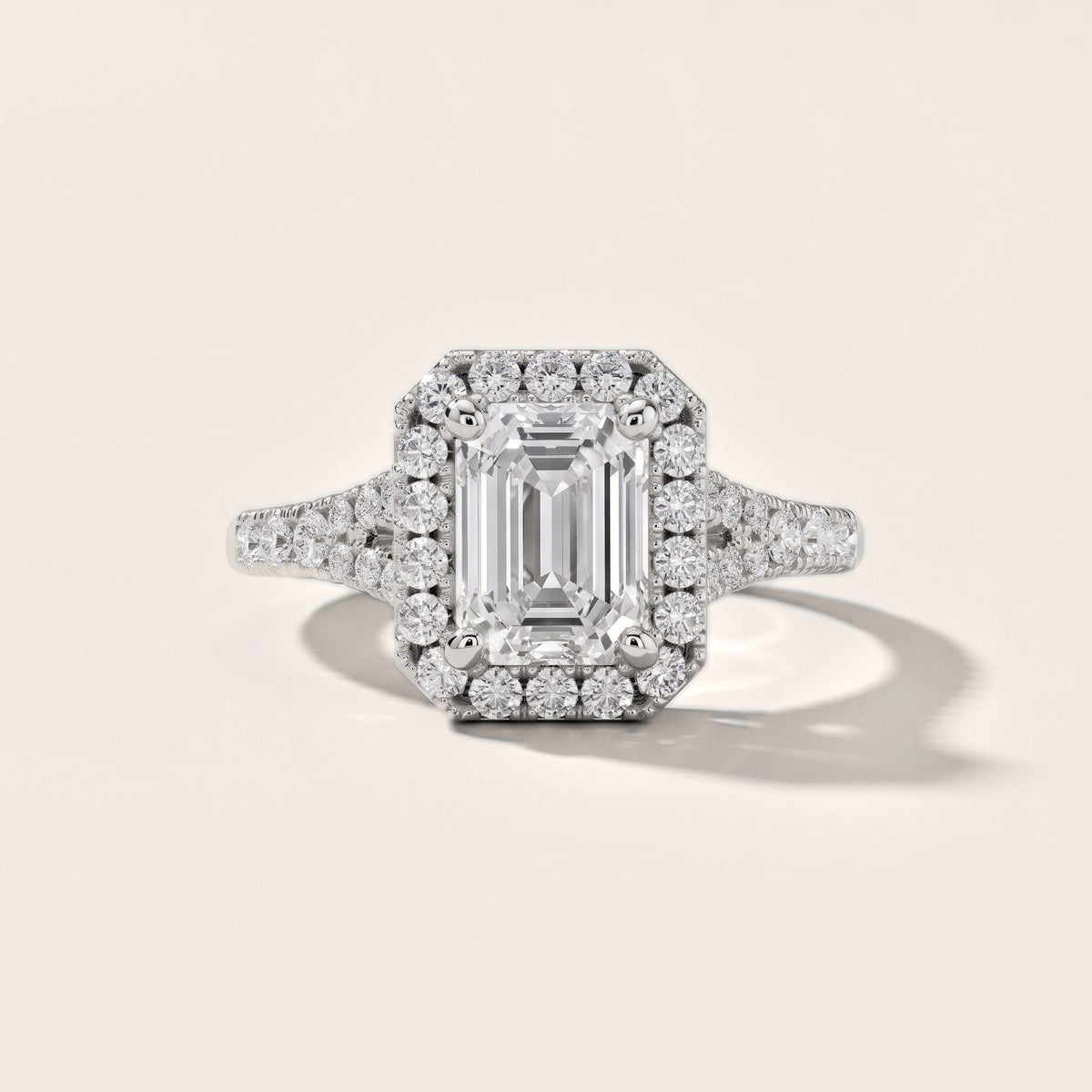 Kenner Halo Split Shank Emerald Diamond Engagement Ring in Platinum - front.jpg
