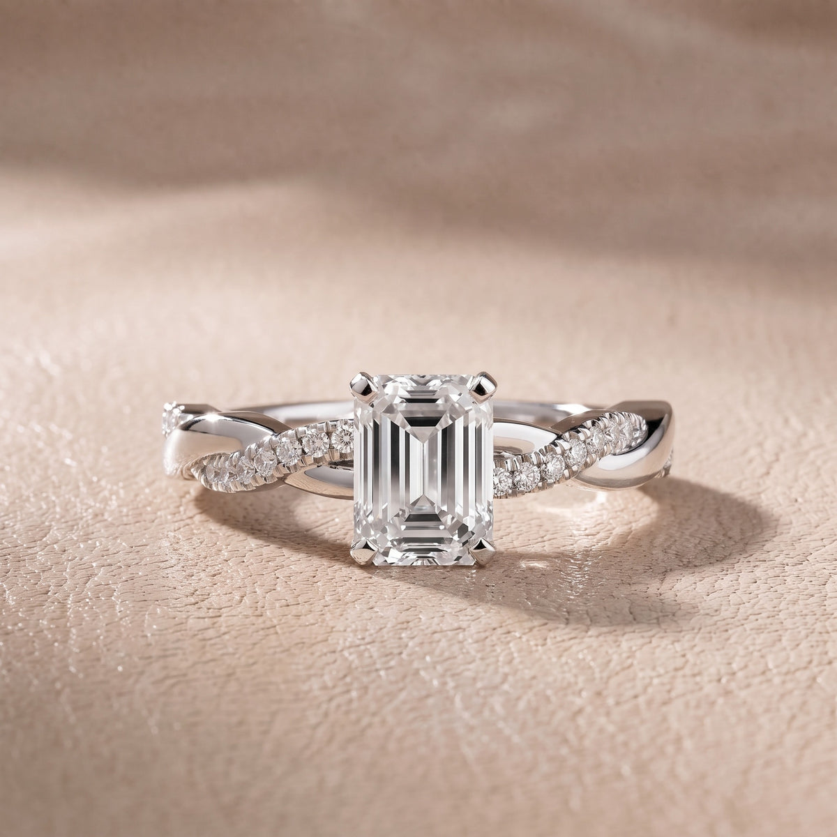 Twisted Side Stone Emerald Diamond Engagement Ring in Platinum - front.jpg
