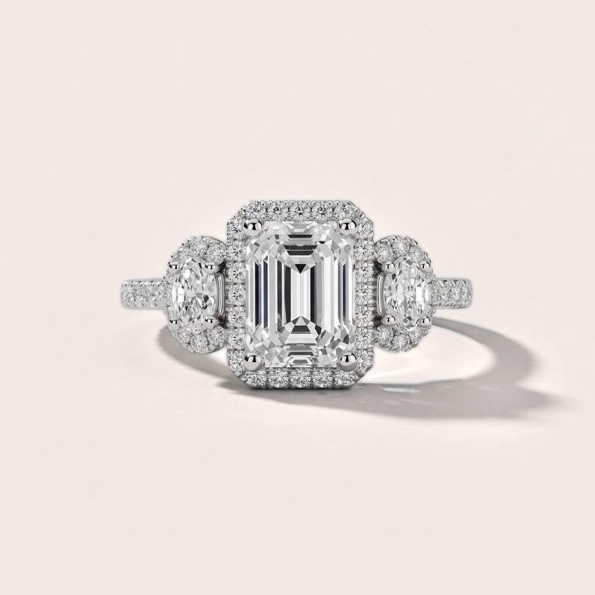Austin Three-Stone Halo Emerald Diamond Engagement Ring in White Gold - front.jpg