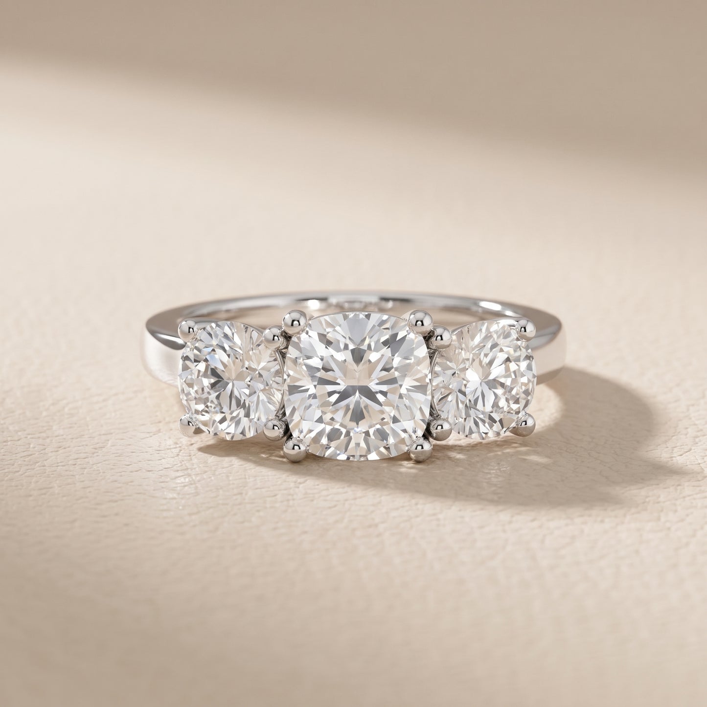 Callie Three-Stone Trellis Cushion Diamond Ring in Platinum - front.jpg