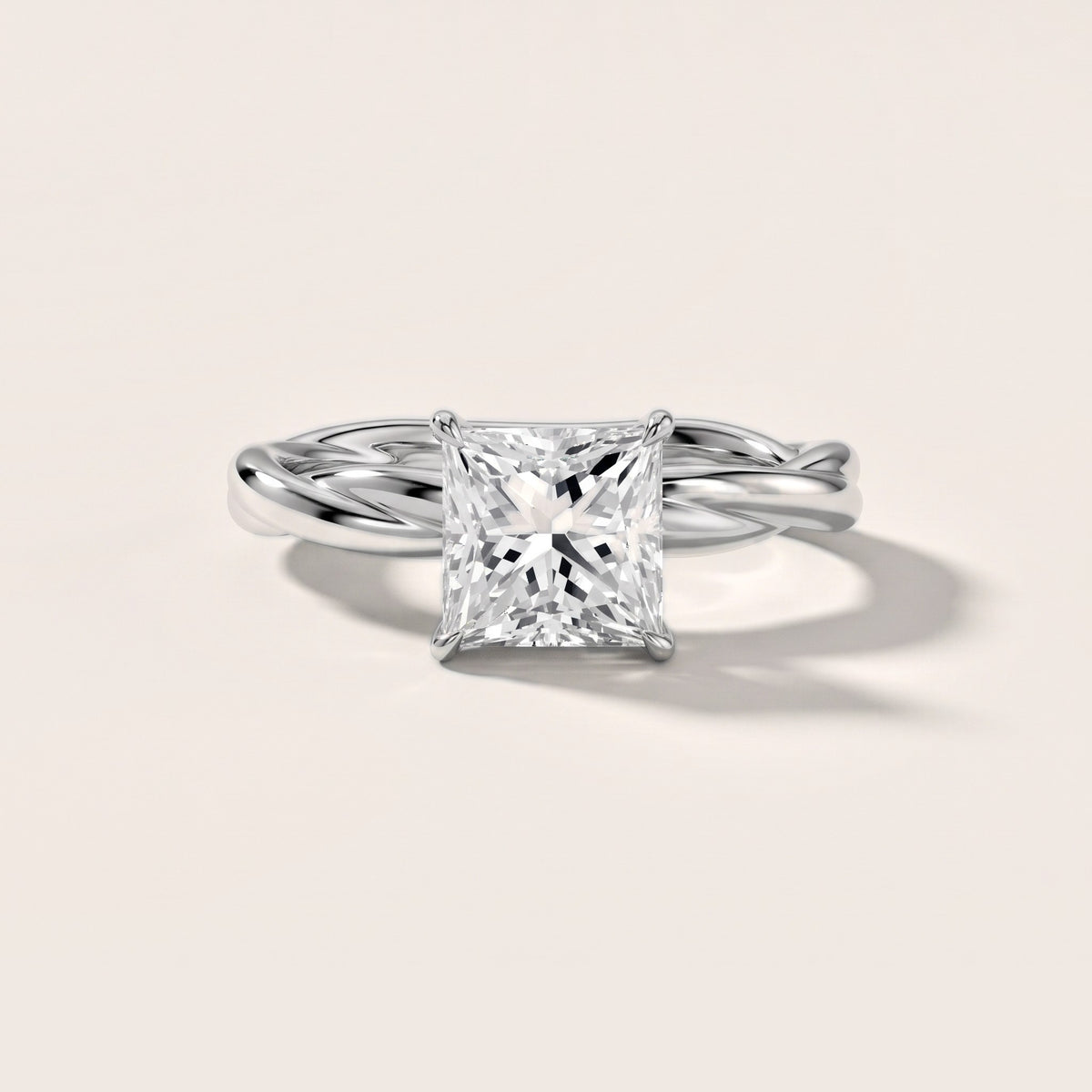 Nicola Twist Solitaire Princess Diamond Engagement Ring in Silver - front.jpg