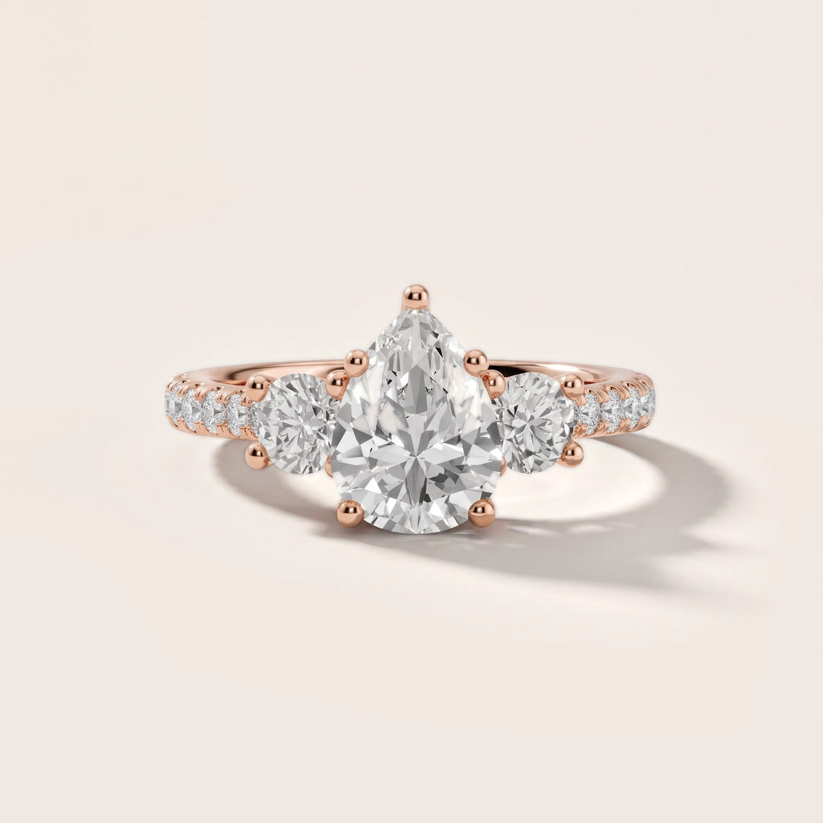 Sibyl Trellis Three-Stone Pear Diamond Engagement Ring in Rose Gold - front.jpg