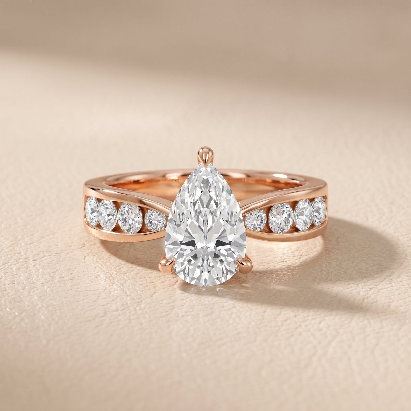 Noor Channel Set Sidestone Pear Diamond Engagement Ring in Rose Gold - front.jpg