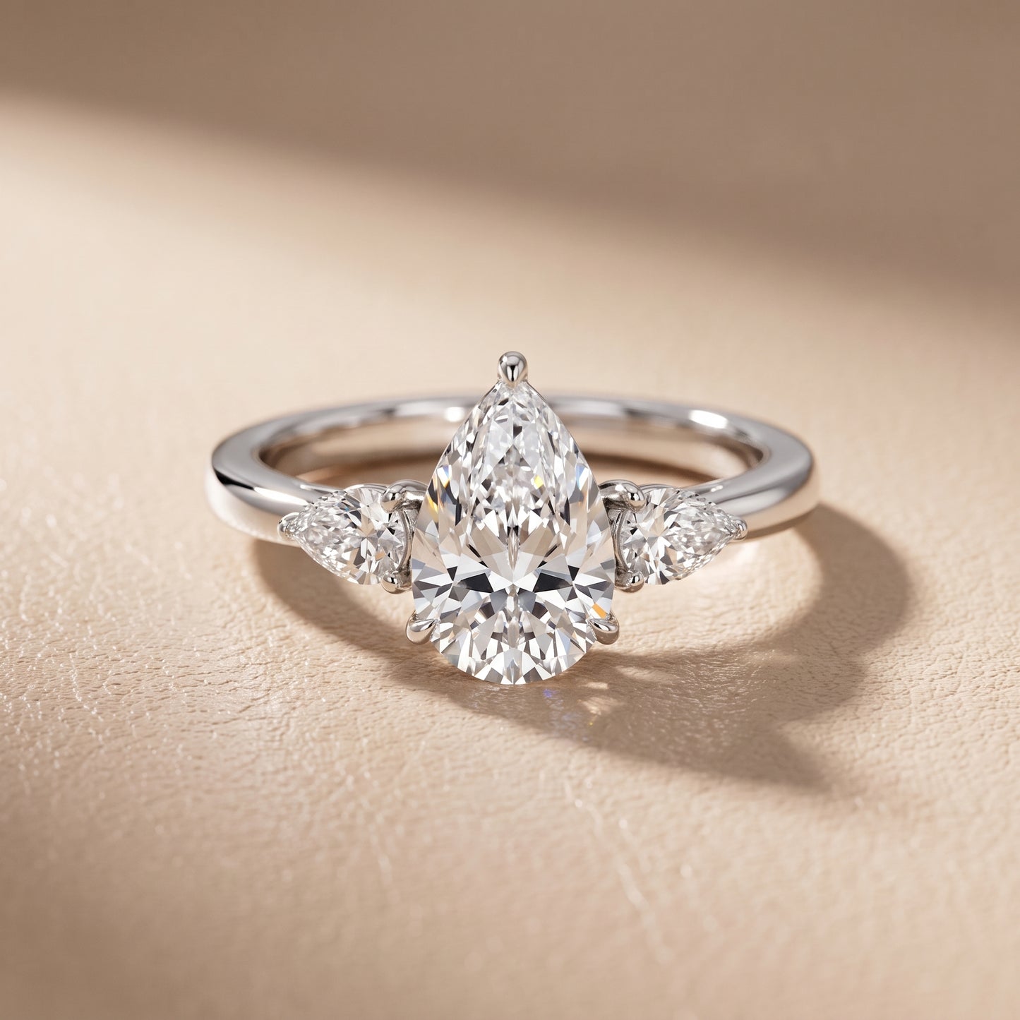 Phoebe Three-Stone Pear Diamond Ring in Platinum - front.jpg