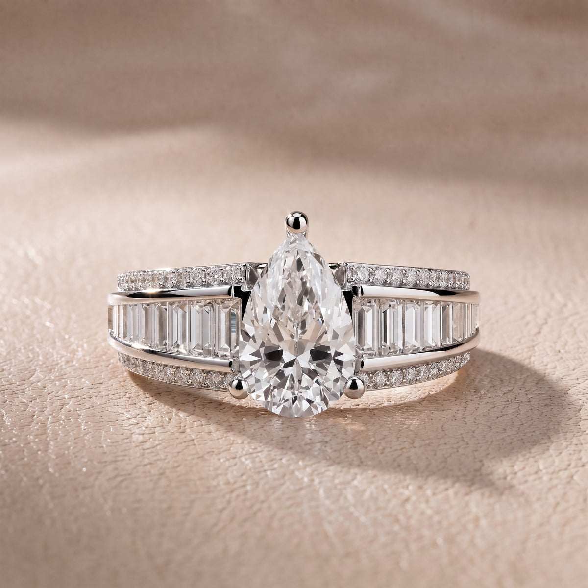 Tara Channel Set Baguette Accent Pear Diamond Engagement Ring in Platinum - front.jpg
