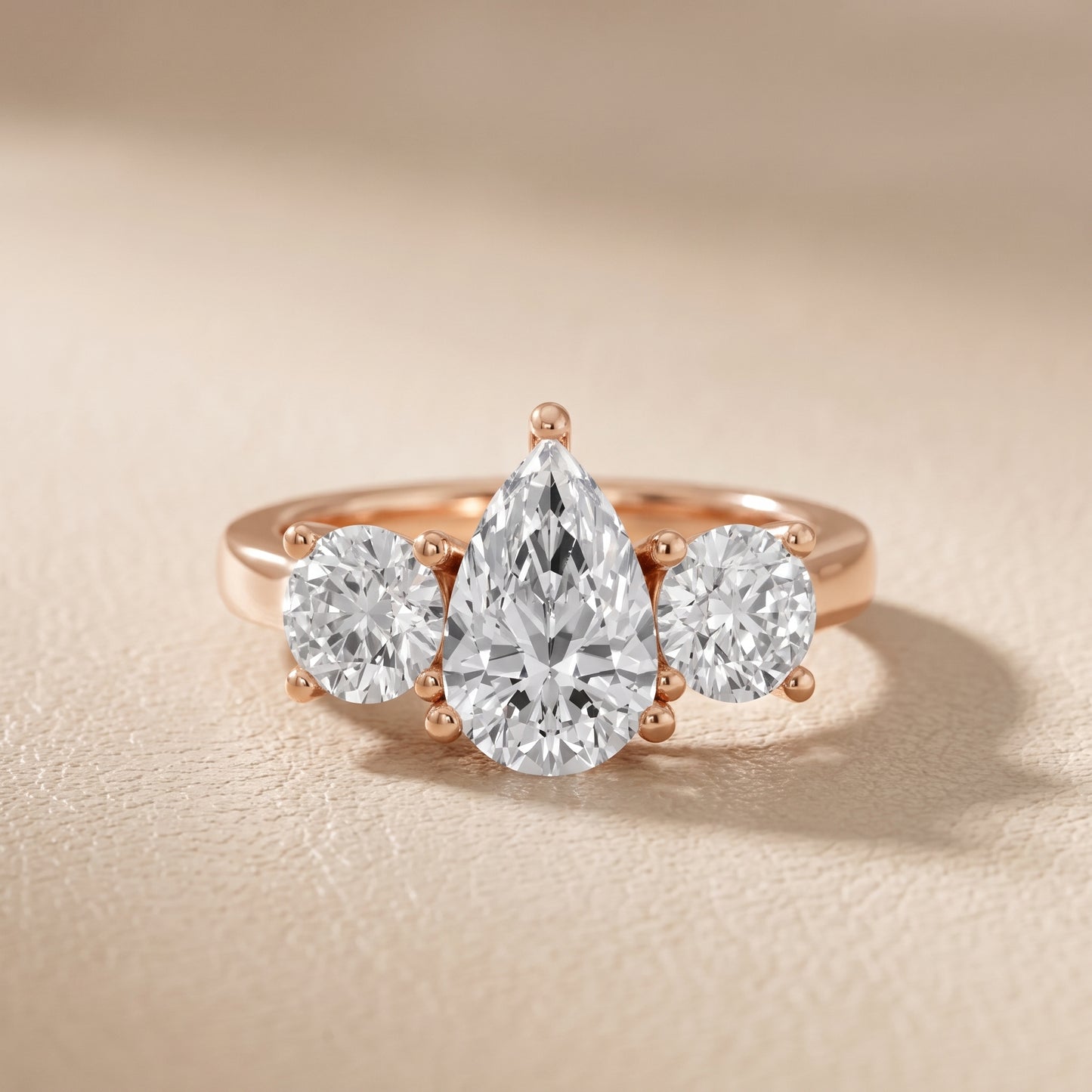 Callie Three-Stone Trellis Pear Diamond Engagement Ring in Rose Gold - front.jpg