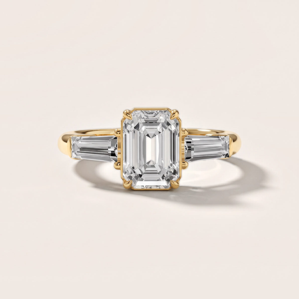 Davina Baguette Three-Stone Emerald Diamond Engagement Ring in Yellow Gold - front.jpg