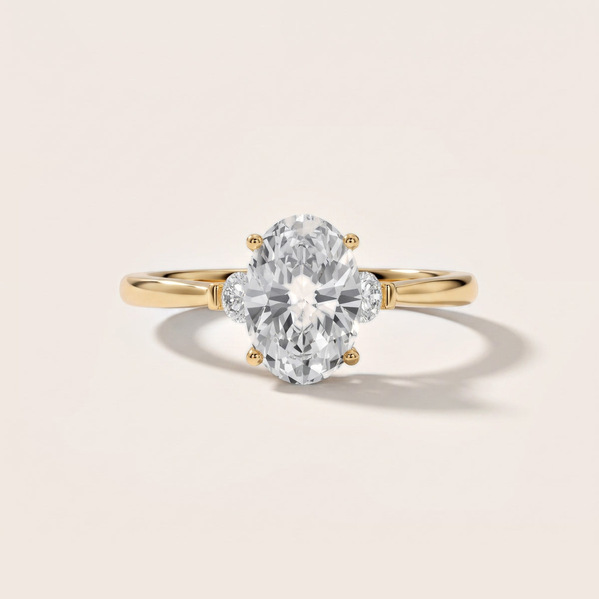 Micaela Three-Stone Oval Diamond Engagement Ring in Yellow Gold - front.jpg