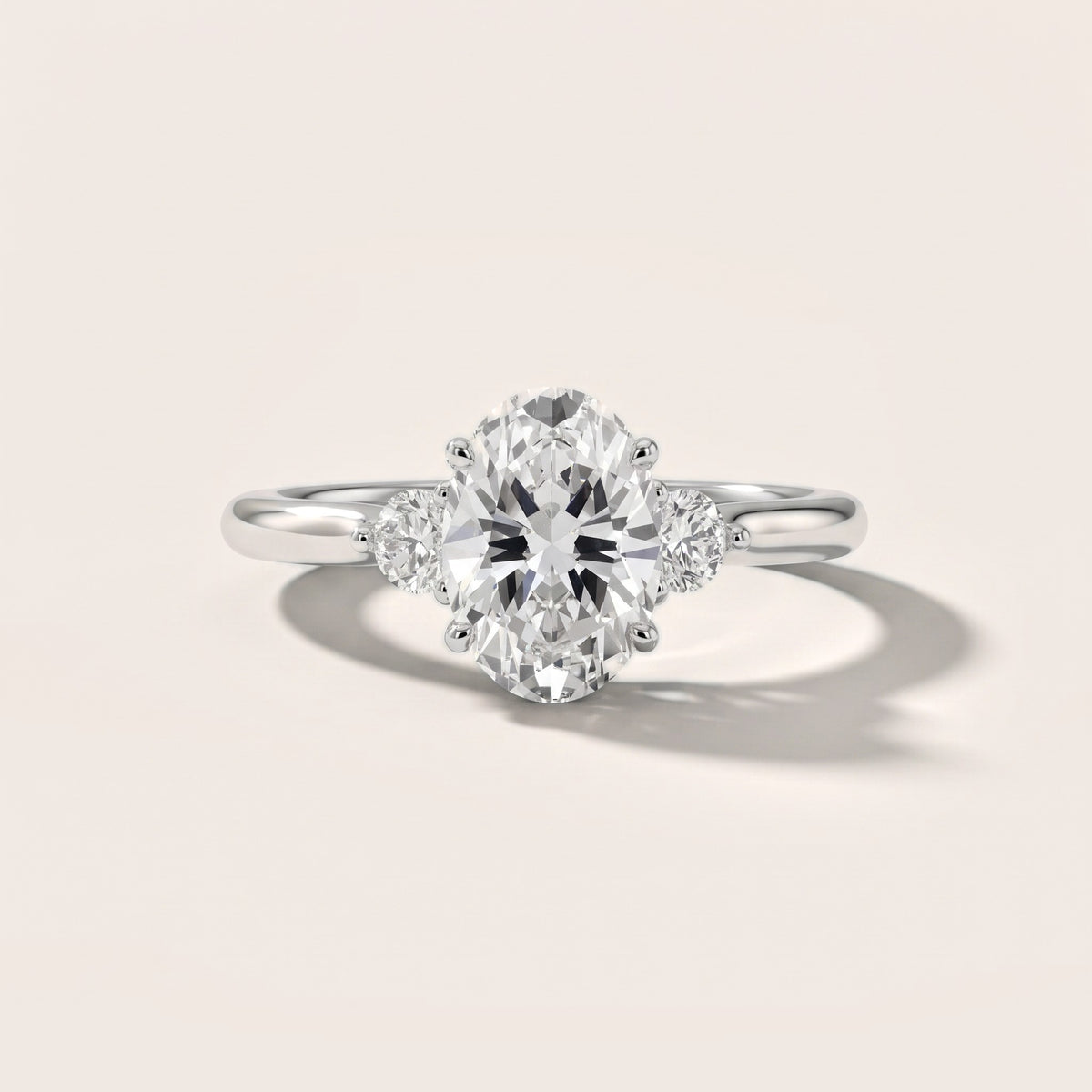 Teresa Three-Stone Cathedral Oval Diamond Engagement Ring in Silver - front.jpg