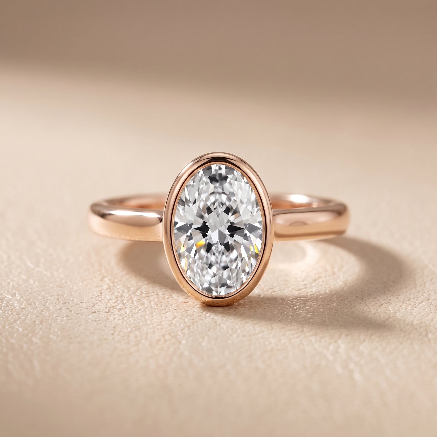 Jolie Bezel Solitaire Oval Diamond Engagement Ring in Rose Gold - front.jpg