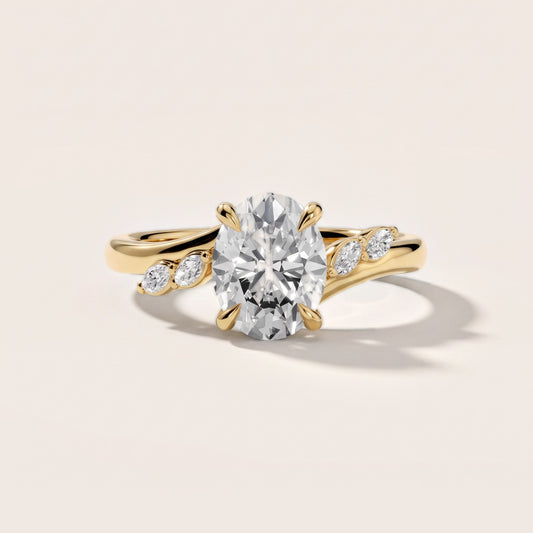 Flora Twist Side Stone Oval Diamond Engagement Ring in Yellow Gold