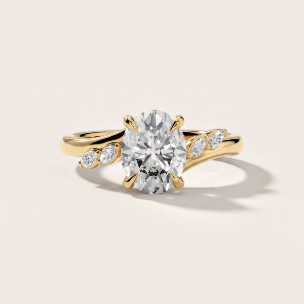 Flora Twist Side Stone Oval Diamond Engagement Ring in Yellow Gold