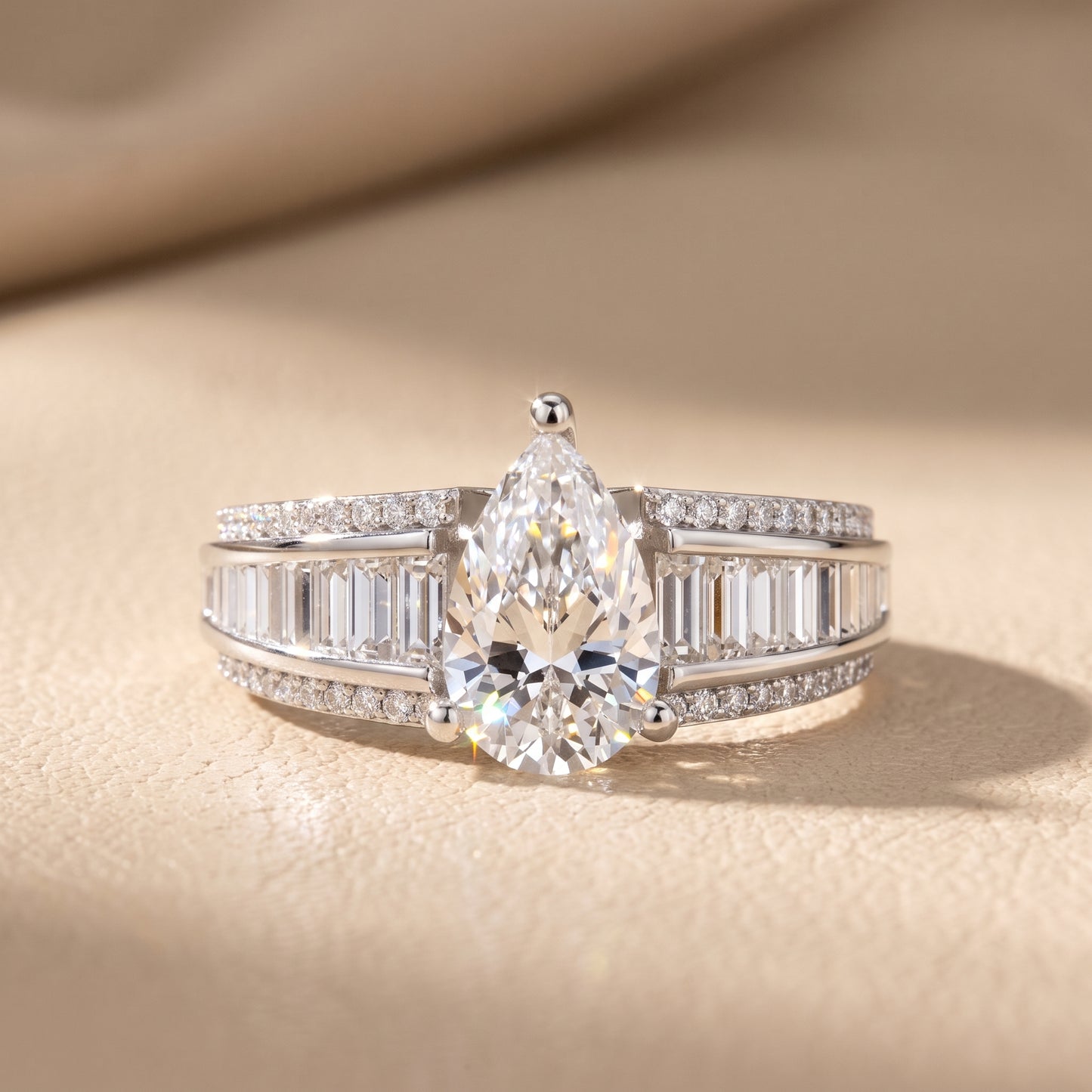 Halle Channel Set Baguette Accent Pear Diamond Engagement Ring in Platinum - front.jpg