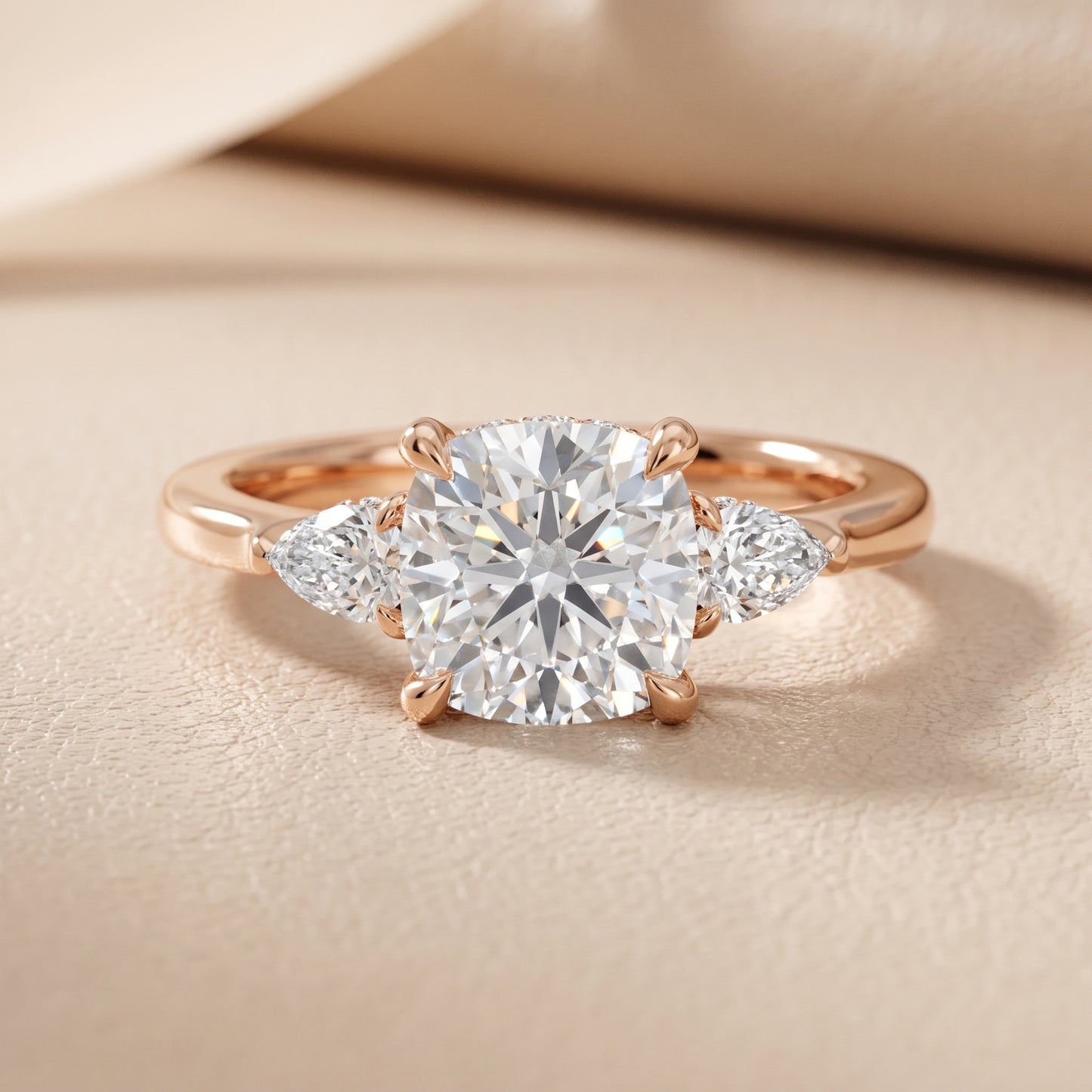 Leila Three-Stone Cushion Diamond Engagement Ring in Rose Gold - front.jpg