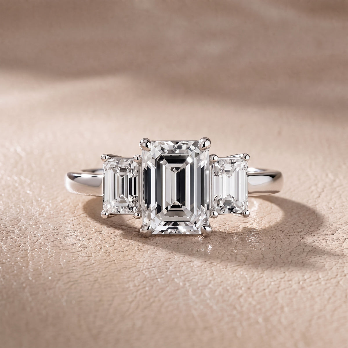 Zoe Three-Stone Emerald Diamond Engagement Ring in Platinum - front.jpg