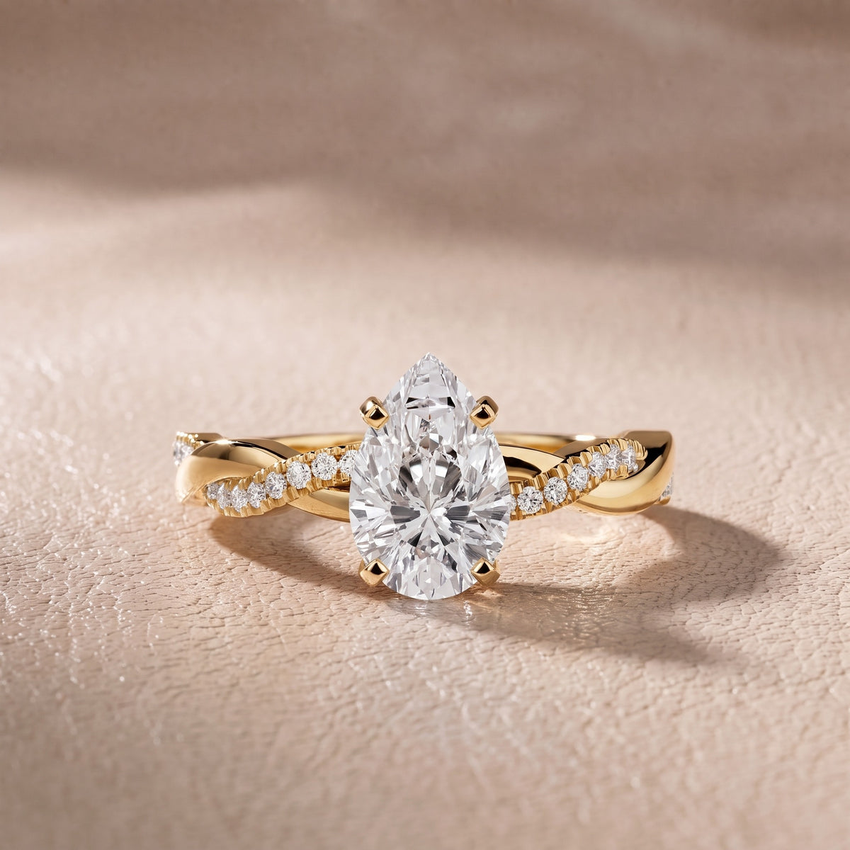 Twisted Side Stone Pear Diamond Engagement Ring in Yellow Gold - front.jpg