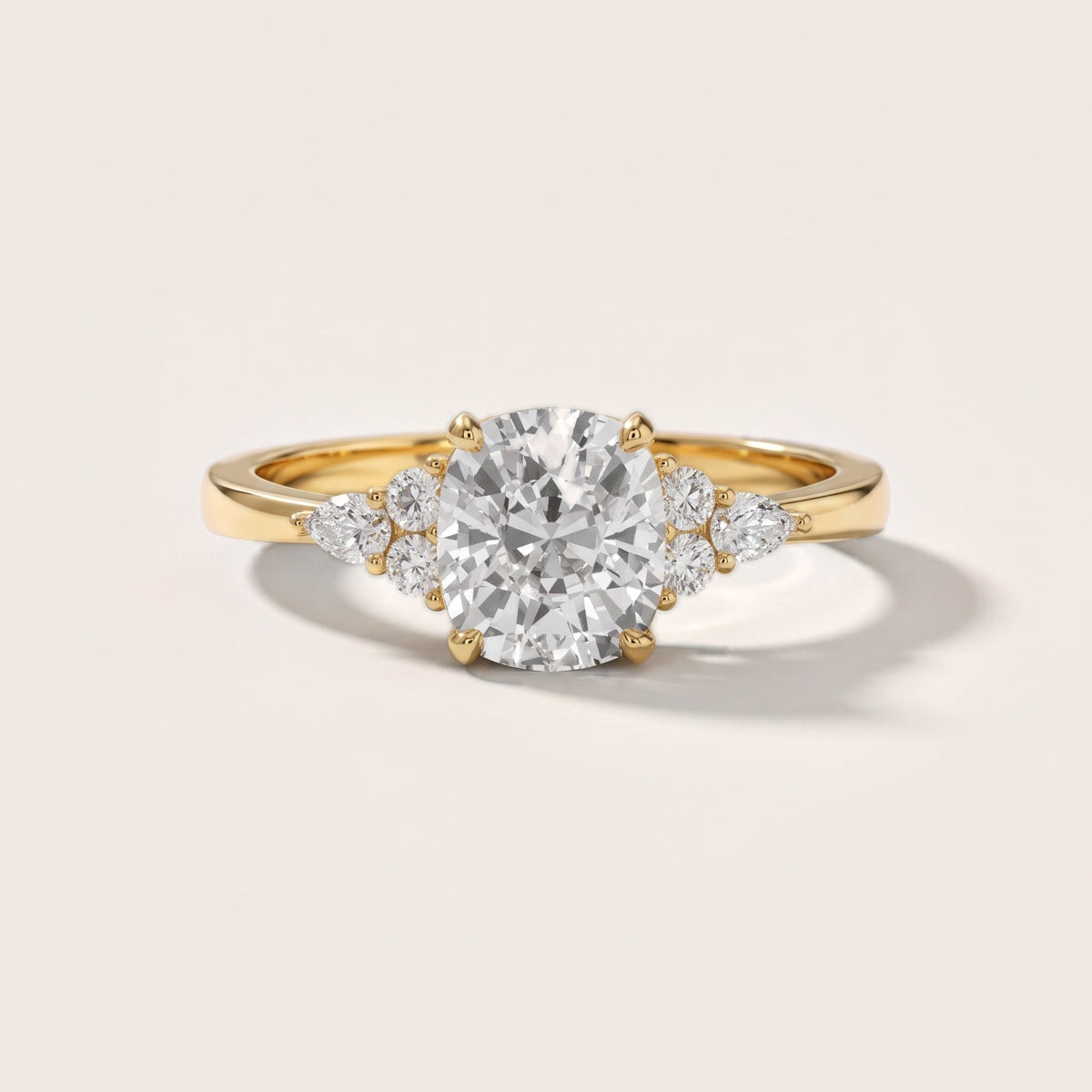 Amelia Three Stone Cushion Diamond Engagement Ring in Yellow Gold